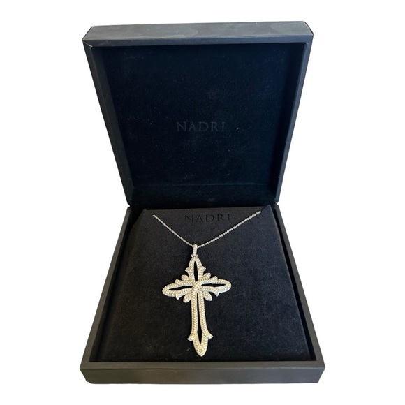 Nadri crystal cross necklace in silver tone setting. Comes in original box.